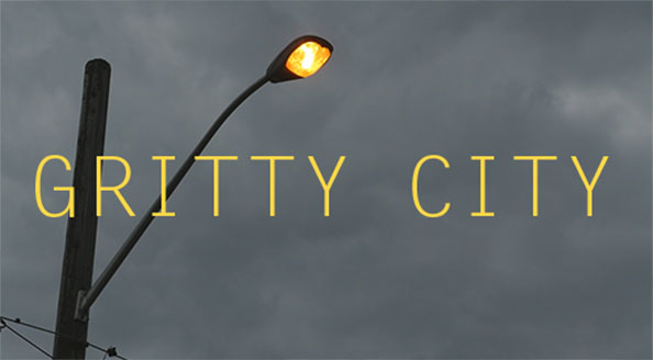 Thumbnail for Gritty City stock footage collection showing Toronto streetlight glowing orange with grey storm clouds